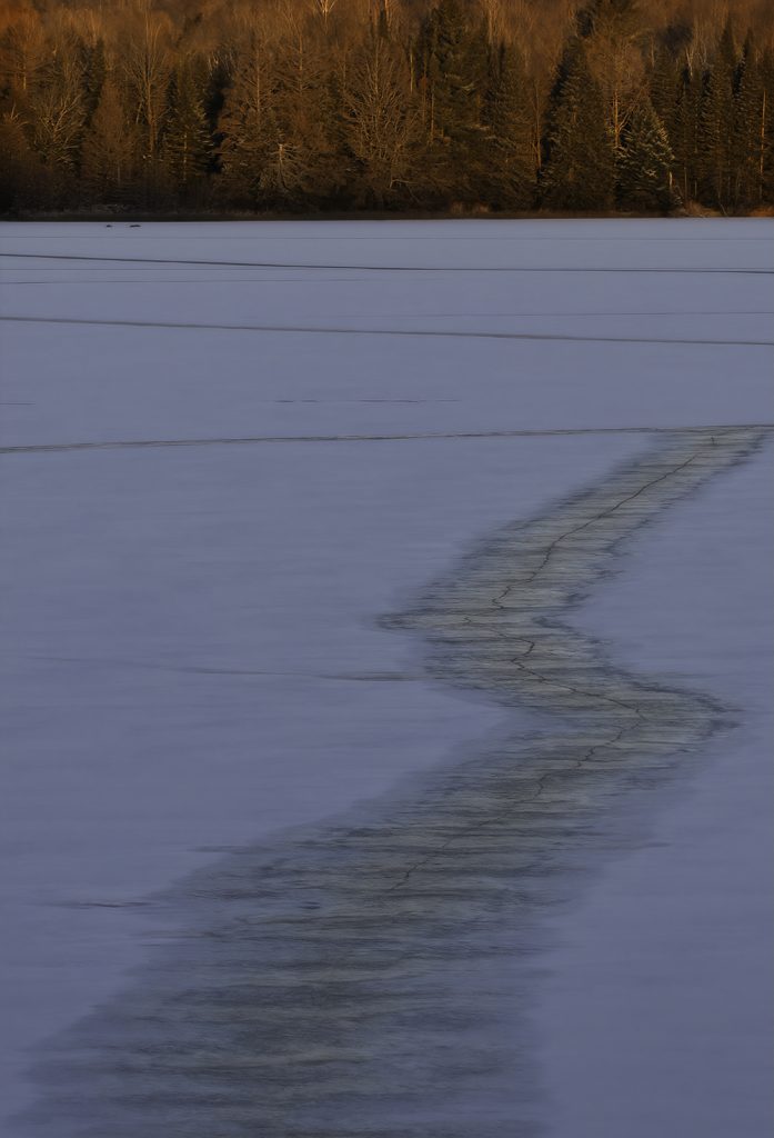 A zig zag crack in the ice after a night of lake singing