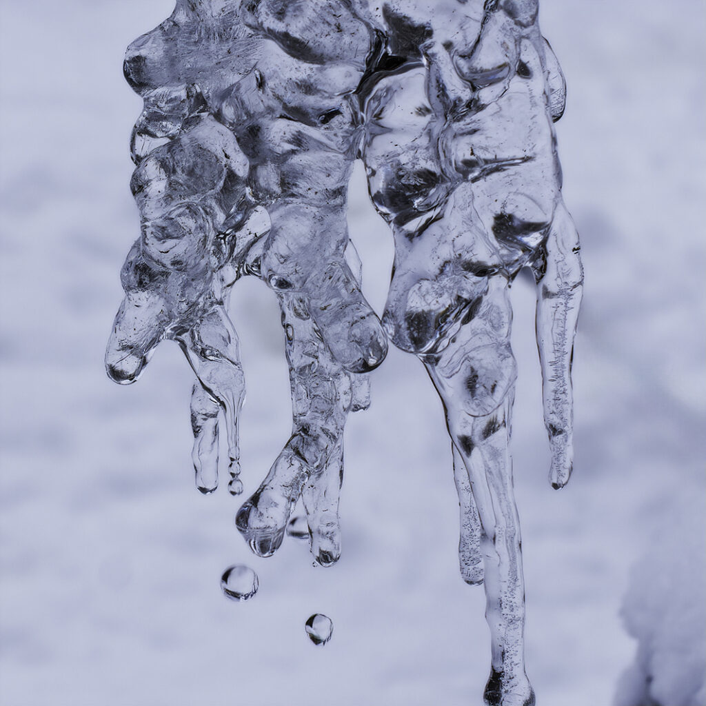 A formation of ice from water falling out of a downspout